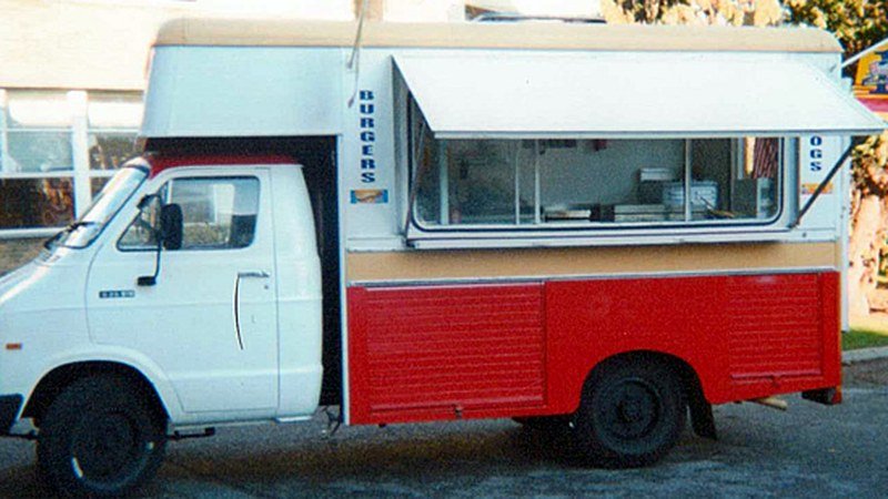 David's repainted red and white catering van with BURGERS signage, ready to trade