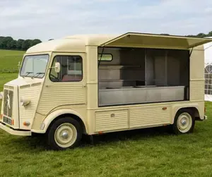 A vintage Citroen HY van converted into a mobile catering unit at a country fete.