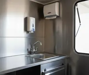 Stainless steel hand wash basin inside a UK mobile catering trailer