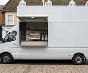 A converted Mercedes Sprinter mobile coffee van with the serving hatch open.