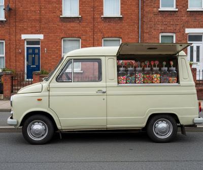 Vintage mobile sweet van with jars of retro sweets on a UK street