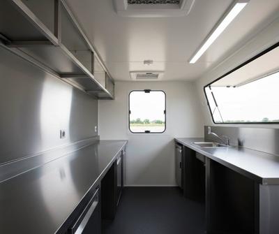 Stainless steel worktops and prep area inside a UK mobile catering trailer