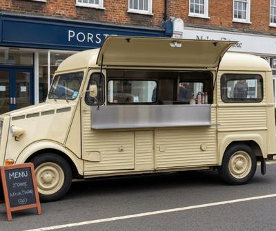 Cream vintage catering van trading on a UK high street