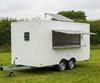 White catering trailer with a roof-mounted solar panel at a British country show