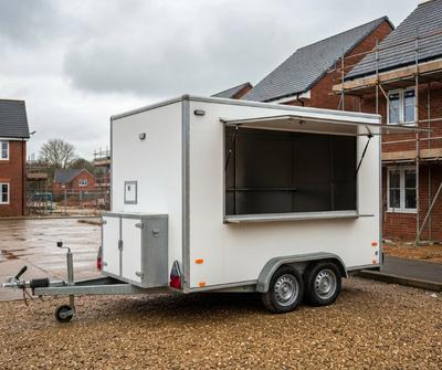 Mobile catering trailer parked on a UK building development site