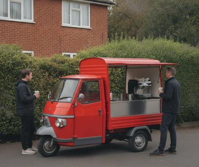 Red vintage Piaggio Ape coffee van serving customers on a UK residential driveway