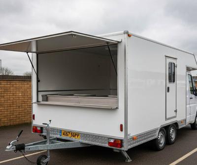 Mobile catering trailer parked at a UK outdoor event pitch