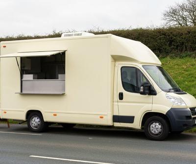 Cream catering van parked in a roadside layby in the UK