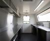 Stainless steel worktops and prep area inside a UK mobile catering trailer