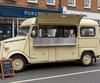 Cream vintage catering van trading on a UK high street