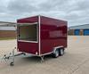 Mobile catering trailer parked on a UK industrial estate pitch