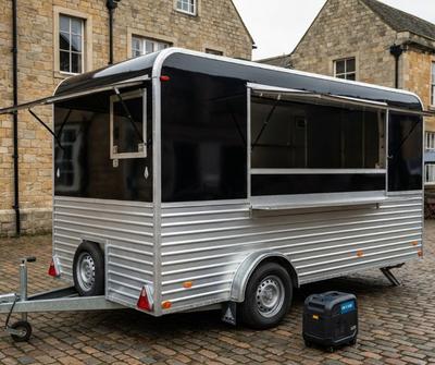 Two-tone black and silver horsebox catering trailer with an inverter generator